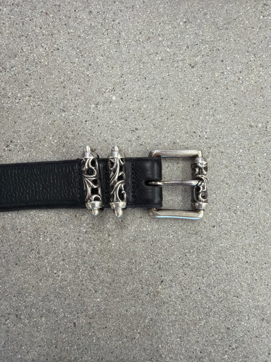 Chrome Hearts Celtic Roller belt buckle detail showing engraved silver dagger keepers on black leather
