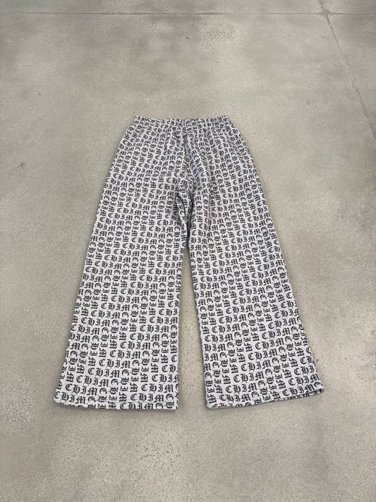HMDD Happy Memories Don't Die sweatpants detail in black with bold white Old English graphic print