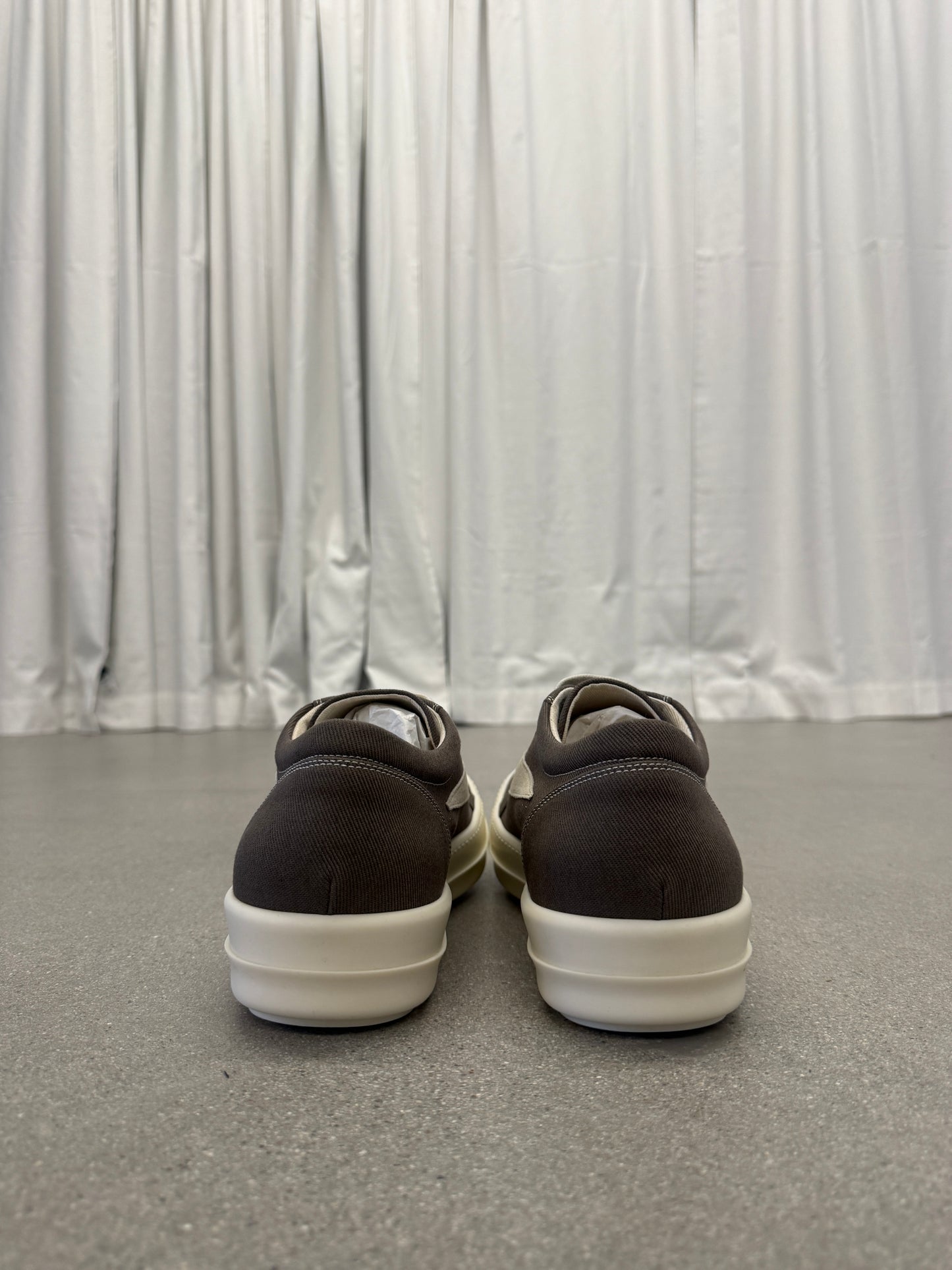 Rick Owens DRKSHDW Dust sneakers heel view with brown leather heels on cream chunky midsoles