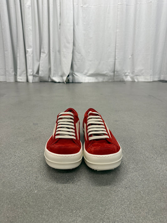 Side profile of Rick Owens Carnelian sneakers in aged grey leather with extended toe and rubber wrap sole.