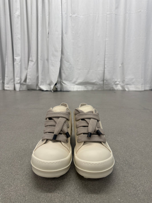Front view of Rick Owens DRKSHDW milk canvas sneakers with thick taupe jumbo laces and white cap toes