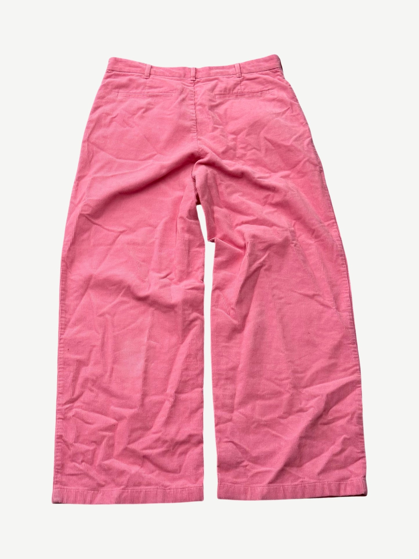 Acne Studios Tango pink corduroy pants back view with welt pockets and wide leg silhouette