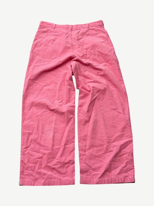 Acne Studios Tango pink corduroy pants back view with welt pockets and wide leg silhouette