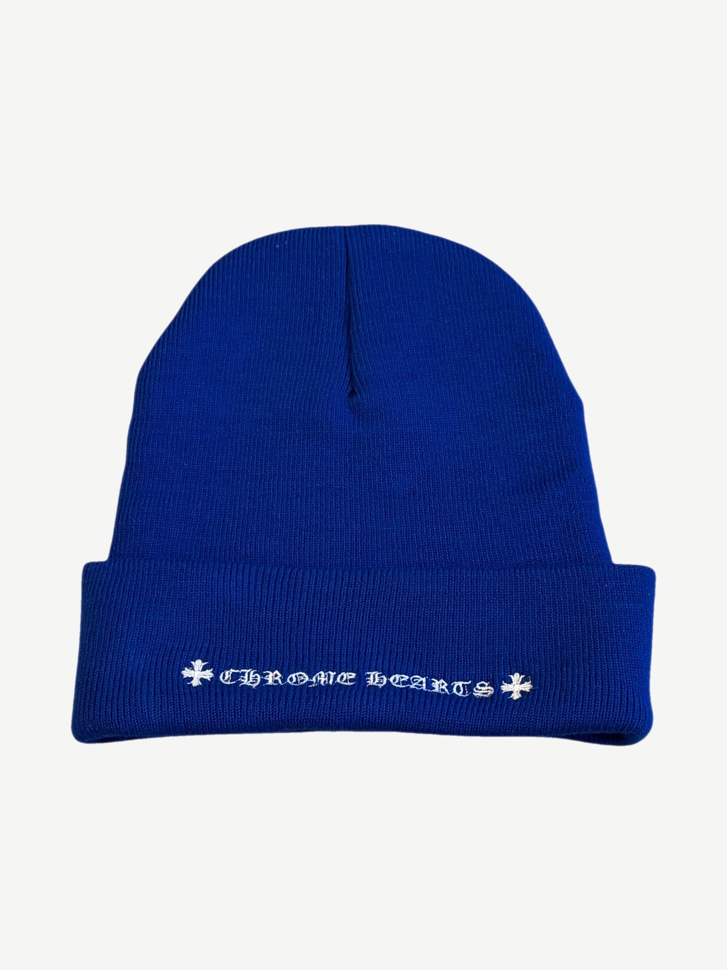 Back of Chrome Hearts blue beanie with embroidered Chrome Hearts script and dagger motifs on cuff.