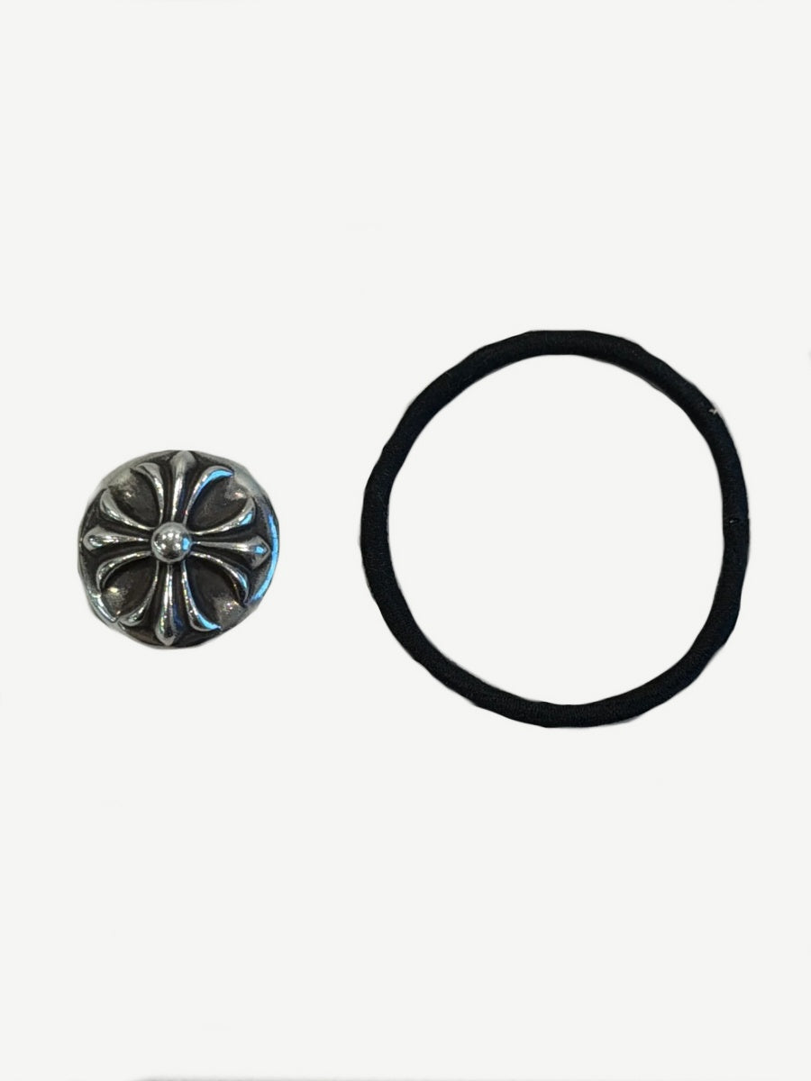 Chrome Hearts silver cross ball charm displayed beside its black elastic hair tie band