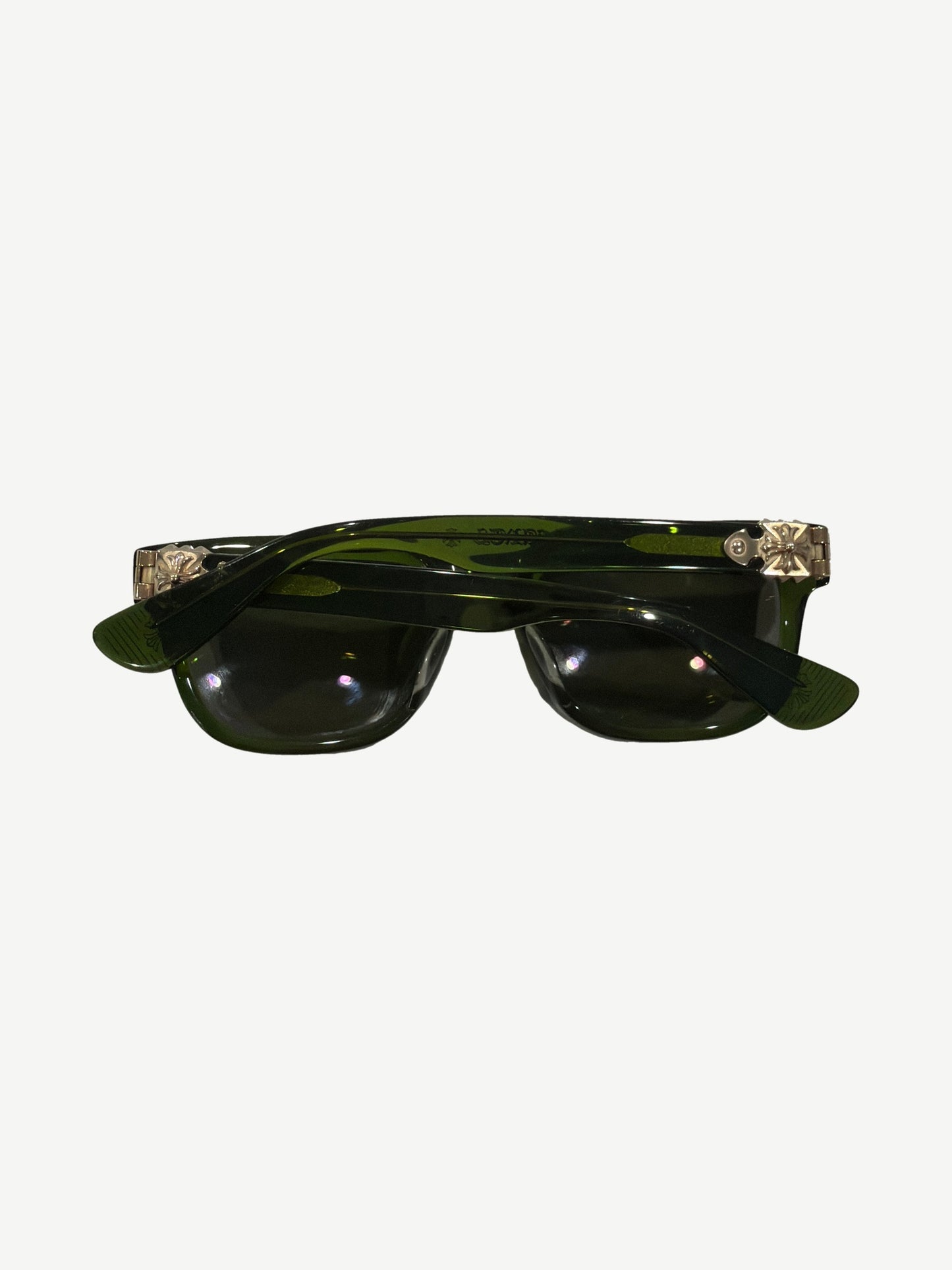 Chrome Hearts Sitonit sunglasses detail of green acetate temple arm with engraved silver hinge plaque