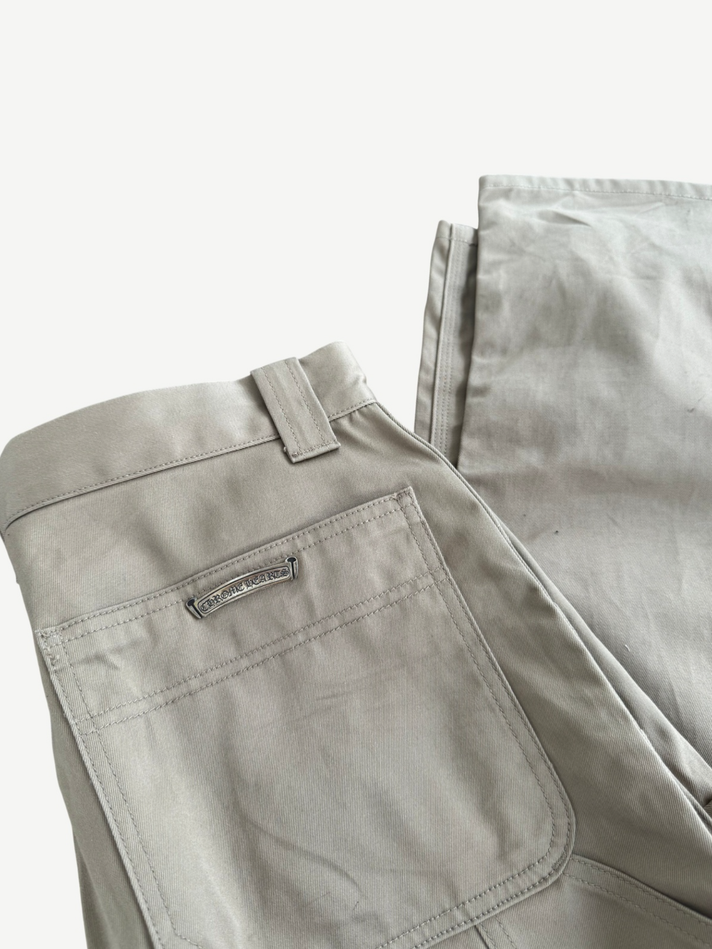 Chrome Hearts khaki carpenter pants back view with rear pockets and hammer loop side detail