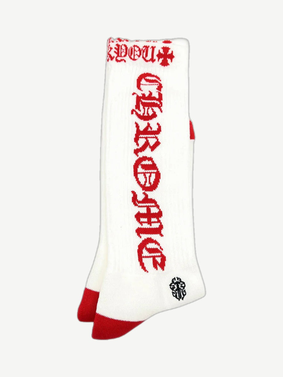 Chrome Hearts white crew socks with red horseshoe scroll logo and contrast knit cuff and toe.