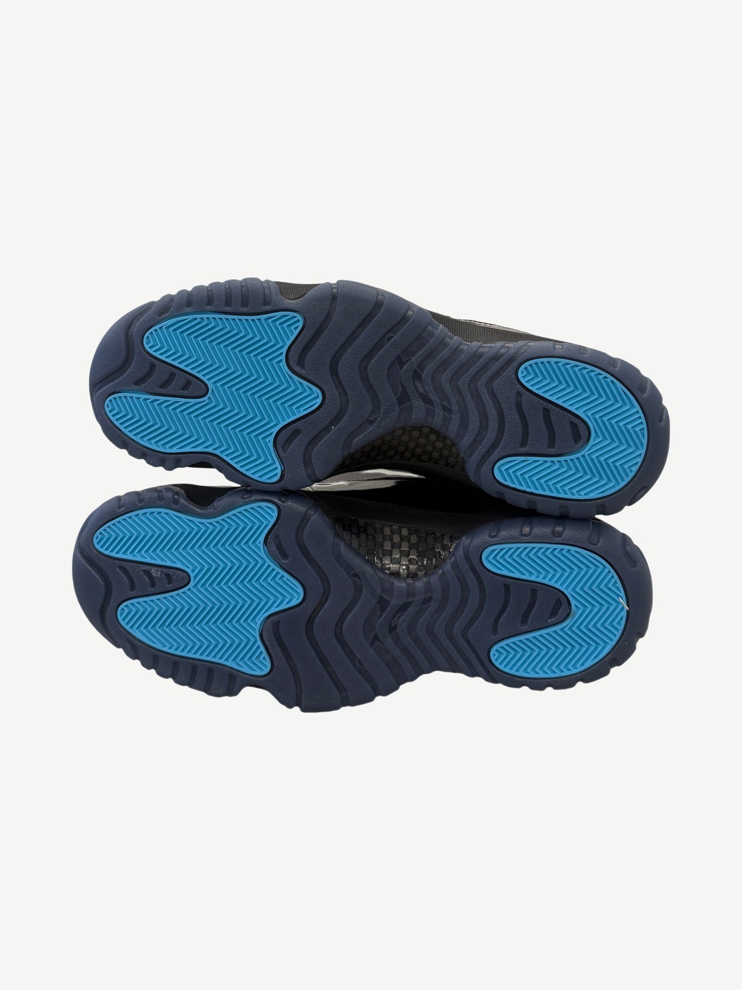 Jordan 11 Retro Gamma Blue heel view with embroidered Jumpman logo on white leather collar panel.