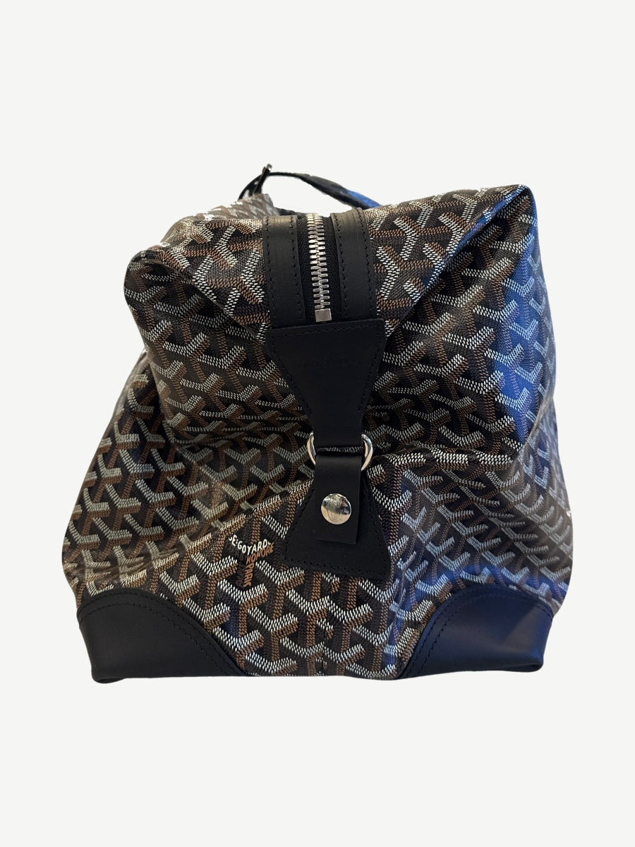 Goyard Boeing 55 duffle bag side profile with brown leather handles and Goyardine chevron print body