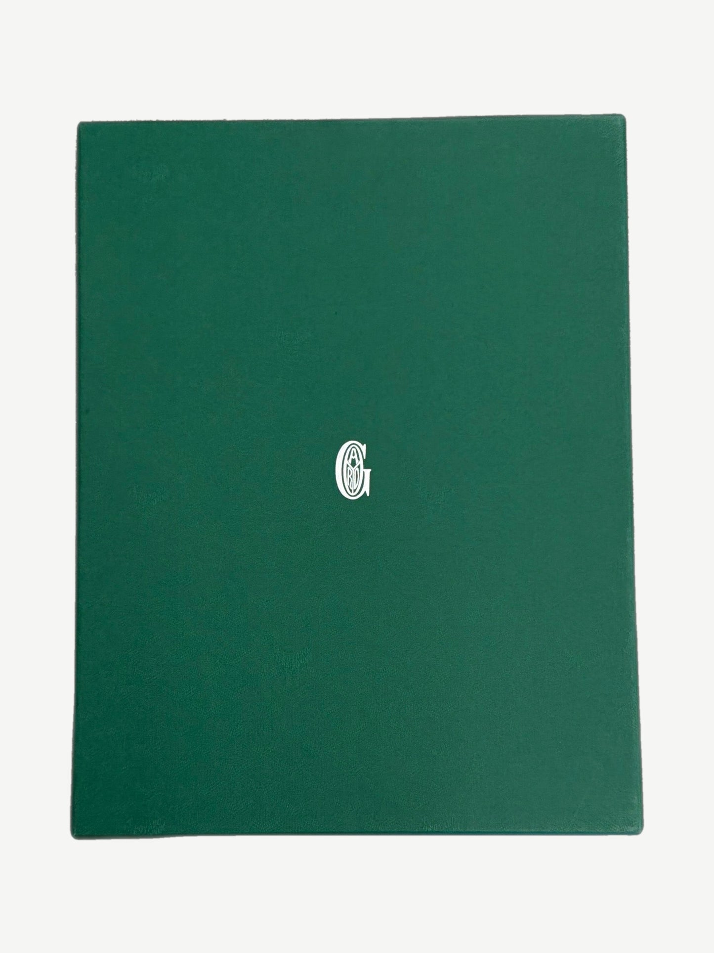 Goyard green leather presentation box with embossed white Maison Goyard monogram cartouche on lid.