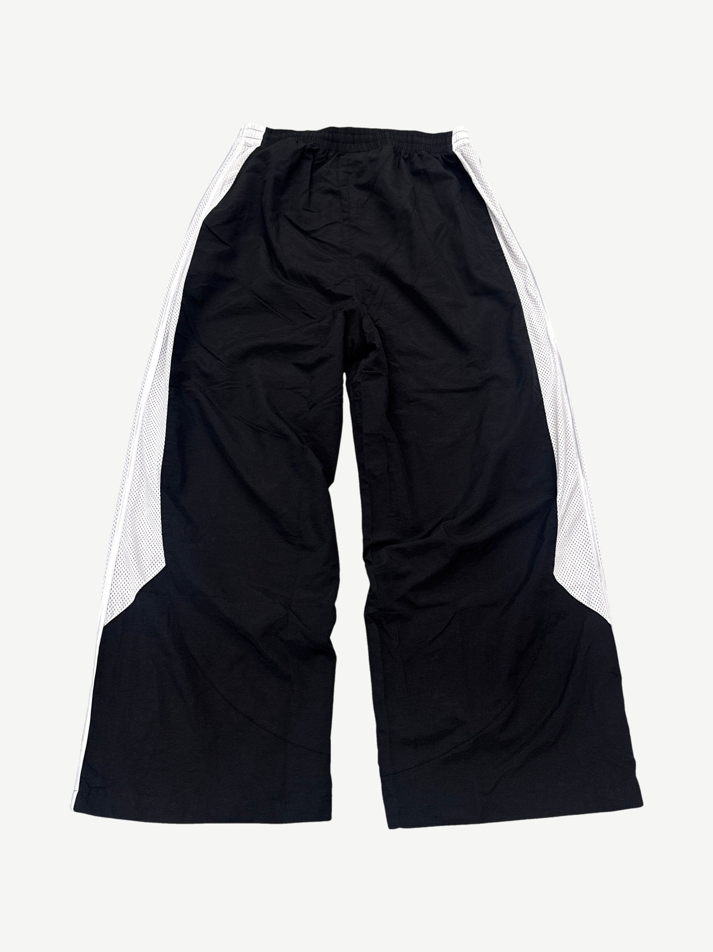 Back of GV Gallery Raspberry Hills black tuxedo sweatpants with contrast tuxedo stripe down each leg.