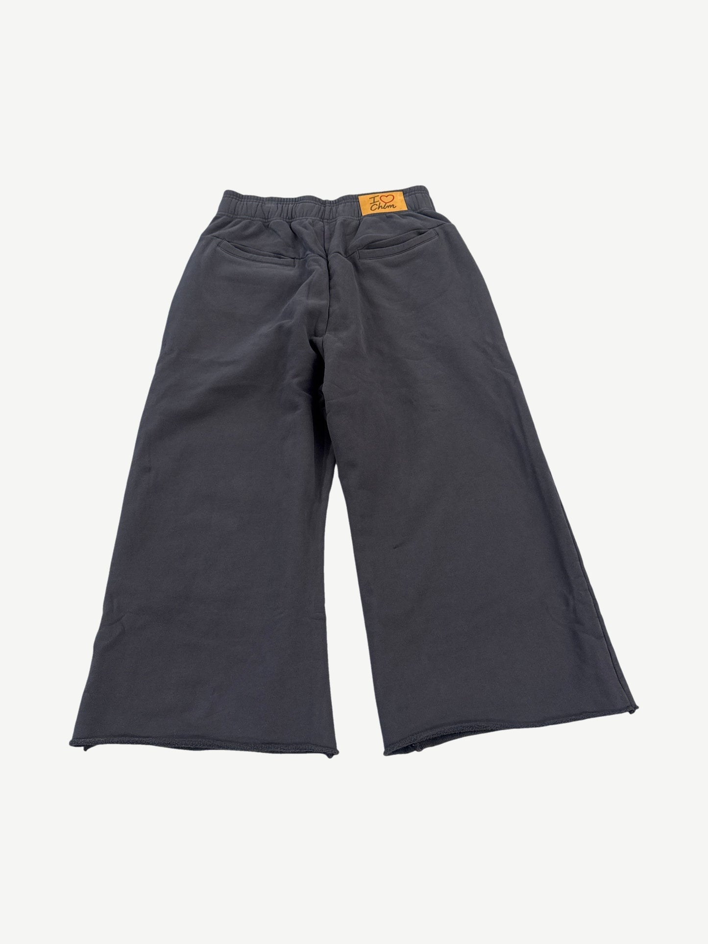 HMDD gray organic cotton 3/4 length sweat shorts back view with tonal logo print detail