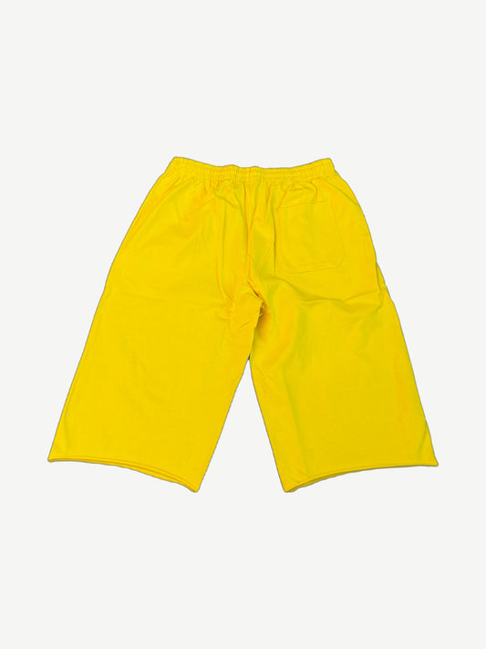 HMDD yellow Program long shorts back view with elastic waistband and rear patch pocket on bright yellow fleece.