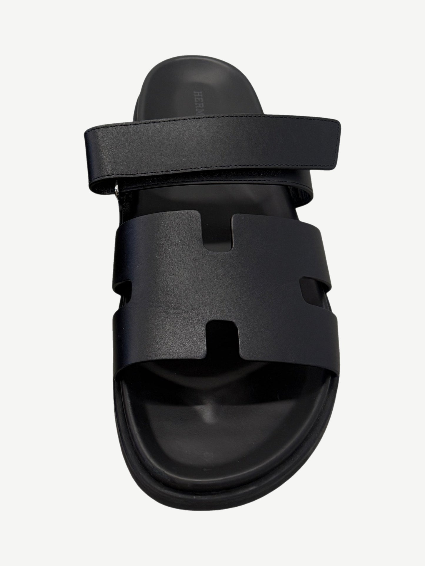 Hermes Chypre sandal single top view with H-cutout vamp strap, adjustable rear strap and molded leather footbed.