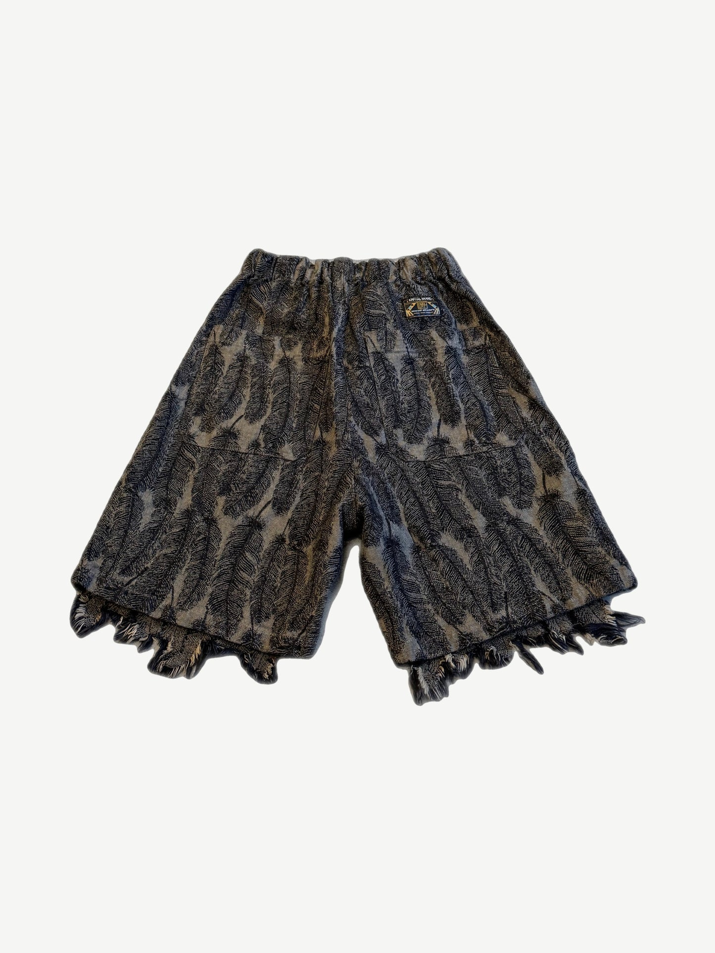 Kapital Magpie denim shorts back view with feather print pattern and wide raw fringed hem detail.