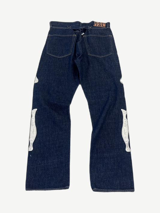 Kapital raw indigo bone denim back view showing dark wash, bone print detail and standard rear pockets.