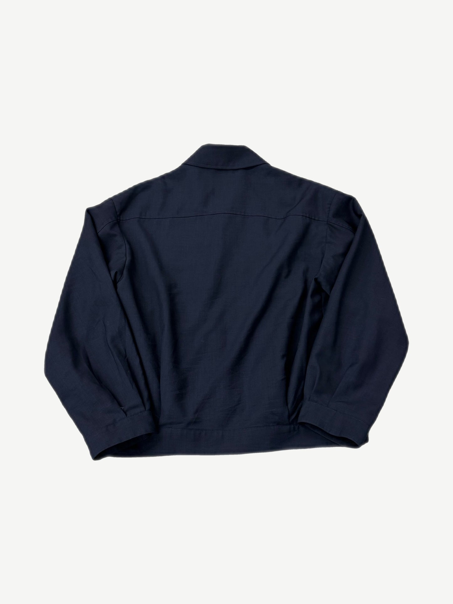 Miu Miu navy blouson jacket back view in mohair wool with clean yoke seam and button cuffs.