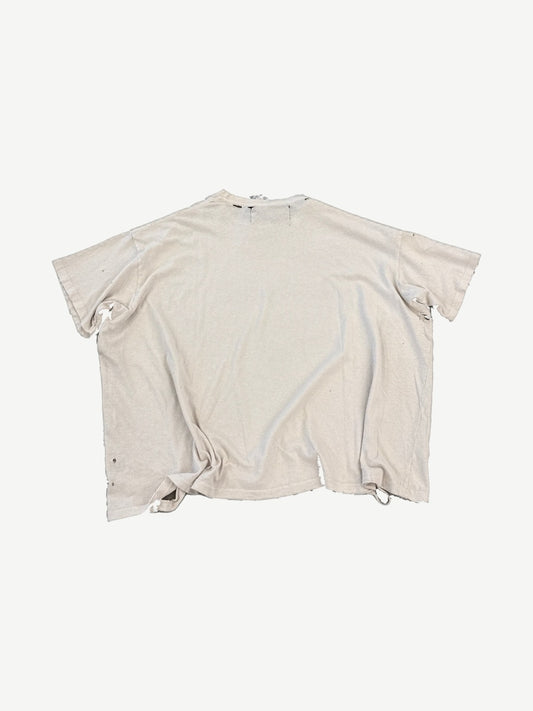 Paly Hollywood cream cropped tee back view showing heavy distressing, holes and raw torn hemline