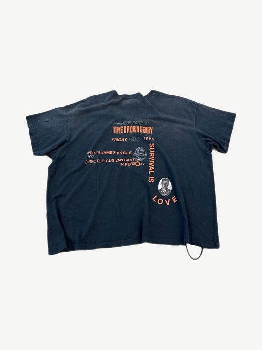 Paly Hollywood faded navy tee back with The Brown Derby premiere party text and orange Survival Is Love mugshot print.