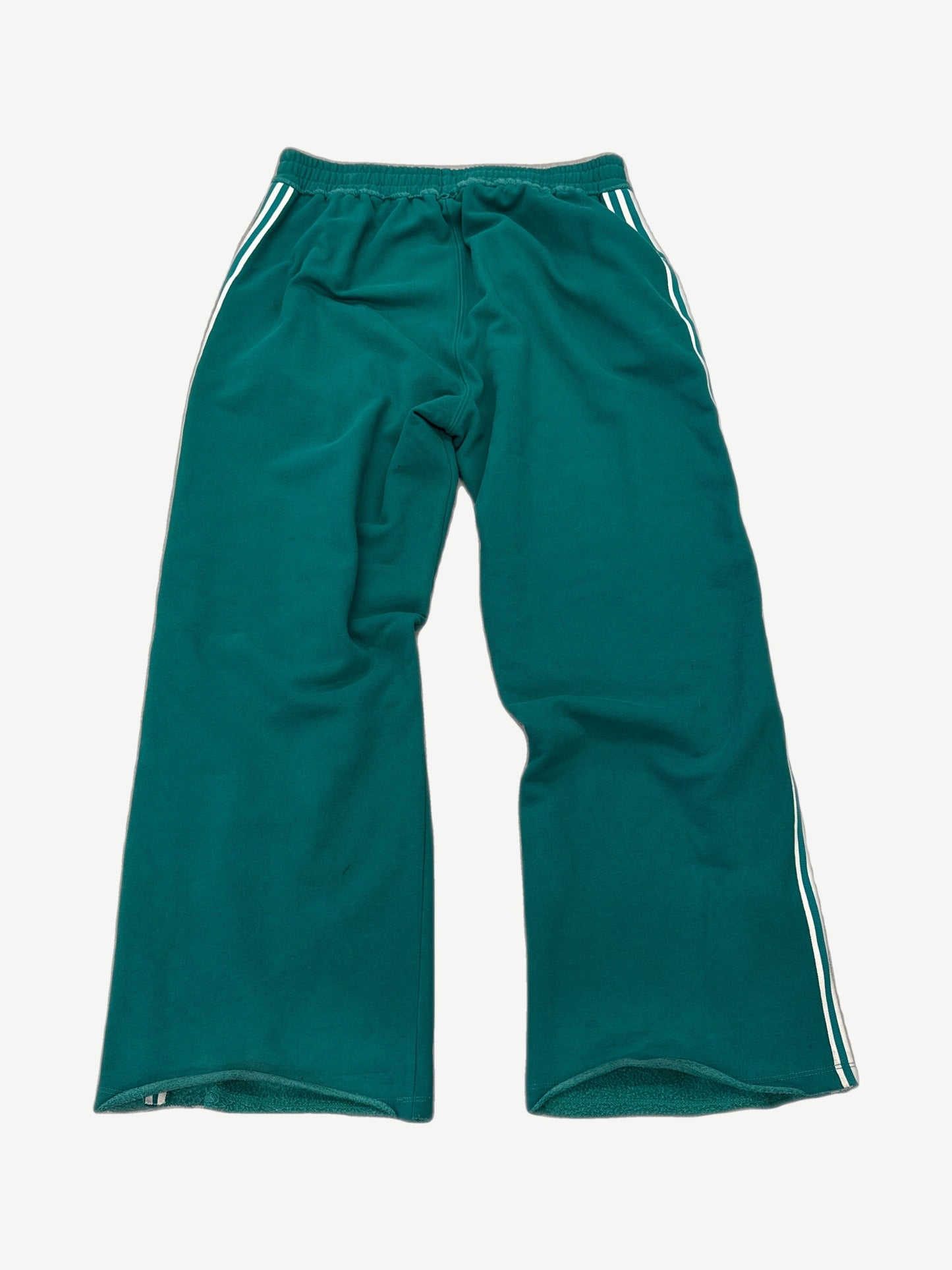 Back view of Raspberry Hills Lil Leon green sweatpants showing relaxed straight fit and elastic ankle cuffs.