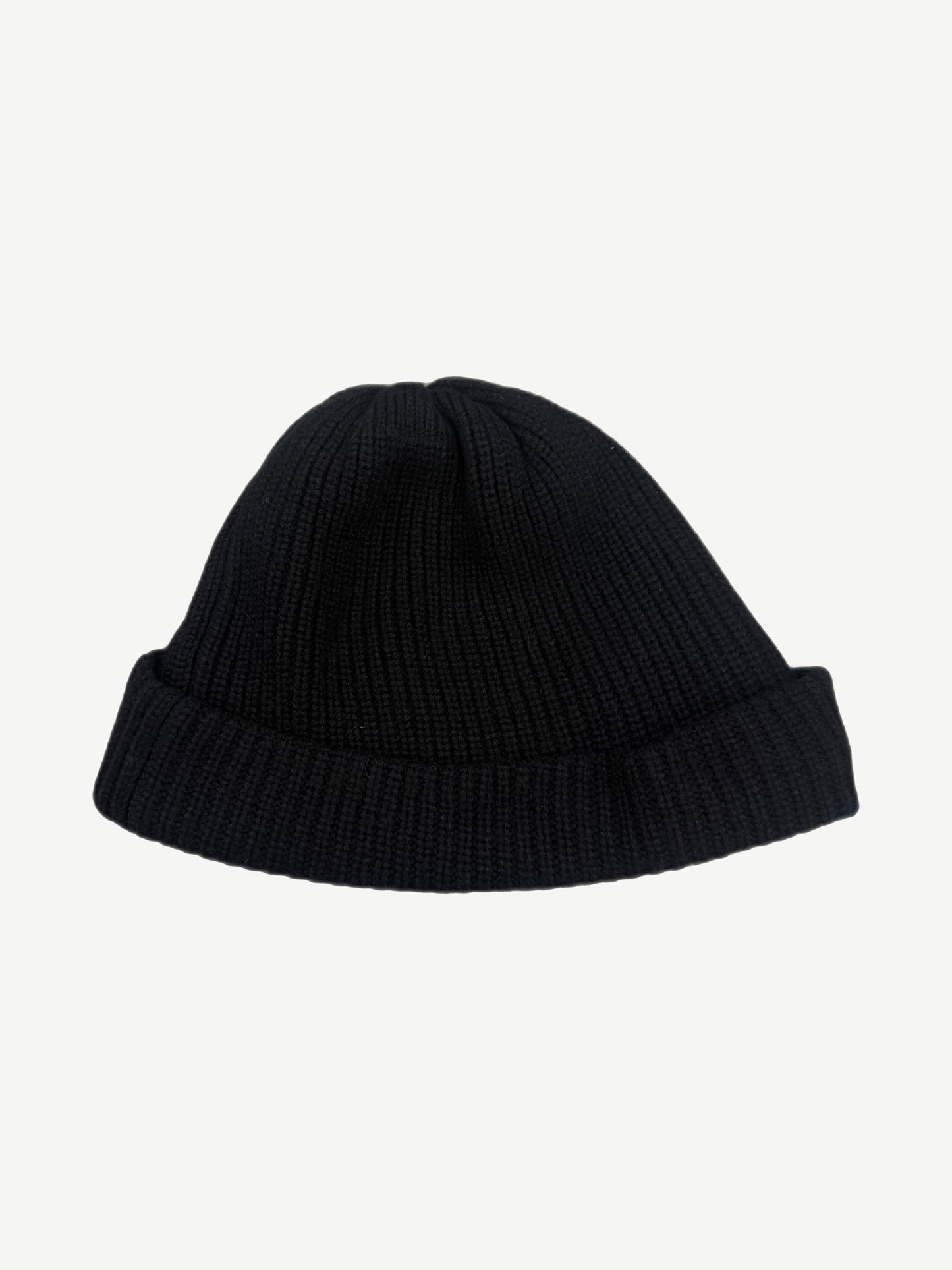 Chrome Hearts black cashmere knit beanie back, plain ribbed cuffed silhouette without graphics.