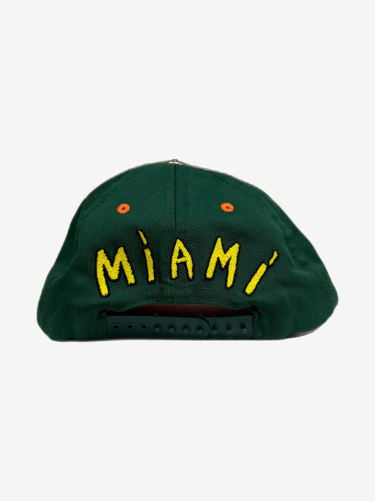 Chrome Hearts Miami baseball cap back, green panel with yellow MIAMI script and adjustable snapback closure.