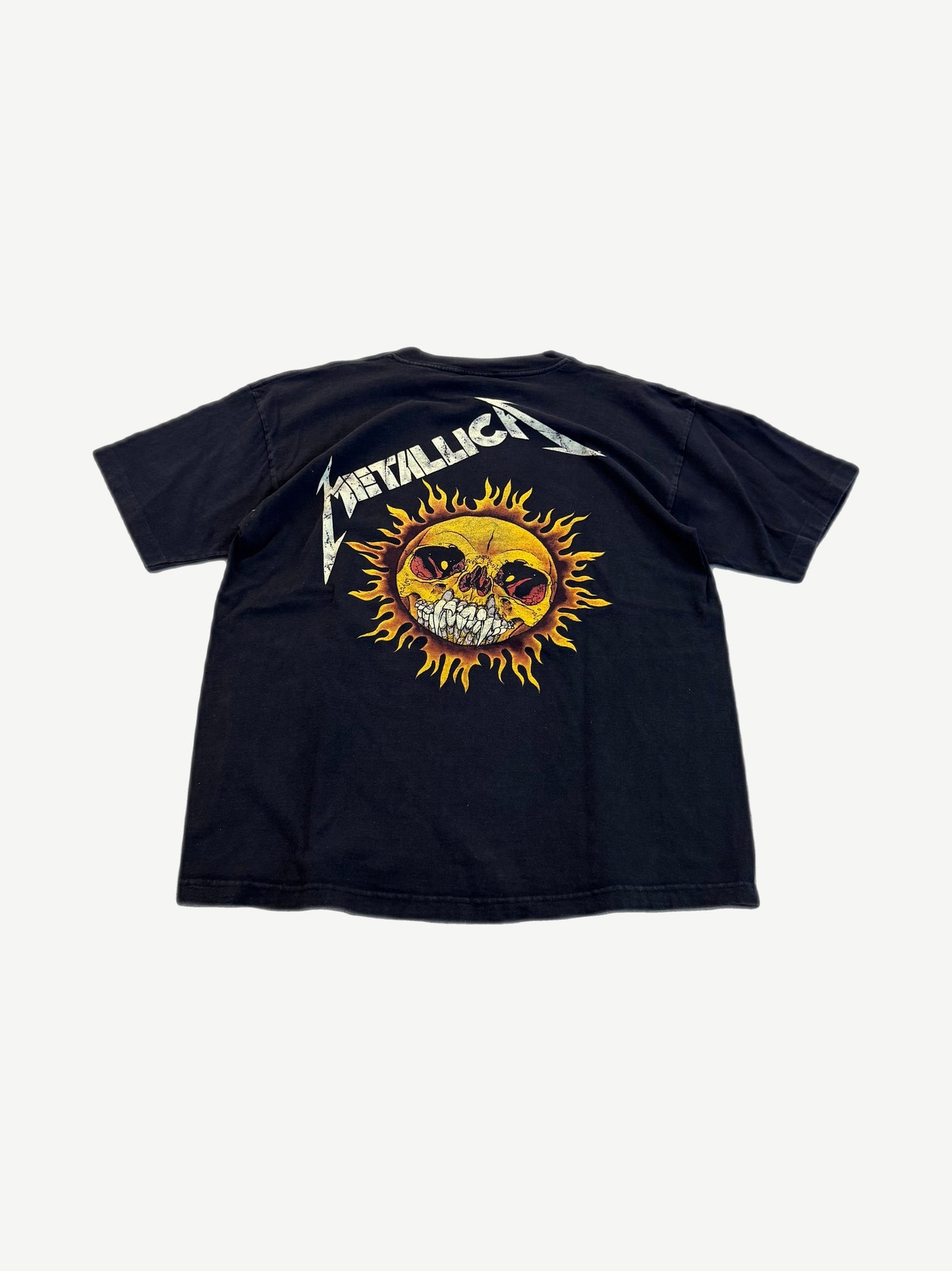 Vintage Metallica black tee back view with Pushead sun face skull graphic and silver band logo above