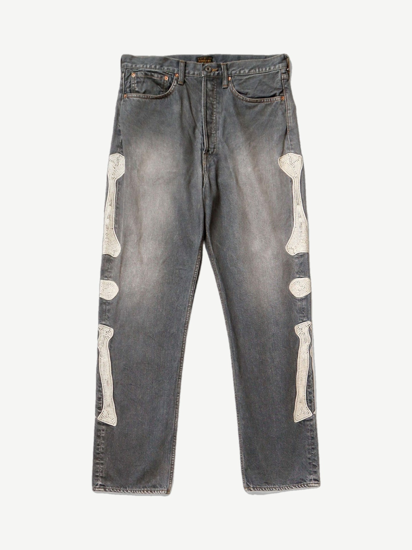 Kapital washed black bone denim jeans with faded fading and signature white skeletal bone graphic on the leg