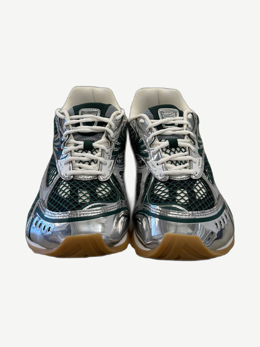 Bottega Veneta Orbit sneakers pair top view in forest green with rubber treaded outsole.