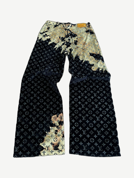 Louis Vuitton bleach monogram jeans back view with tonal LV leather pocket tag and flared hem
