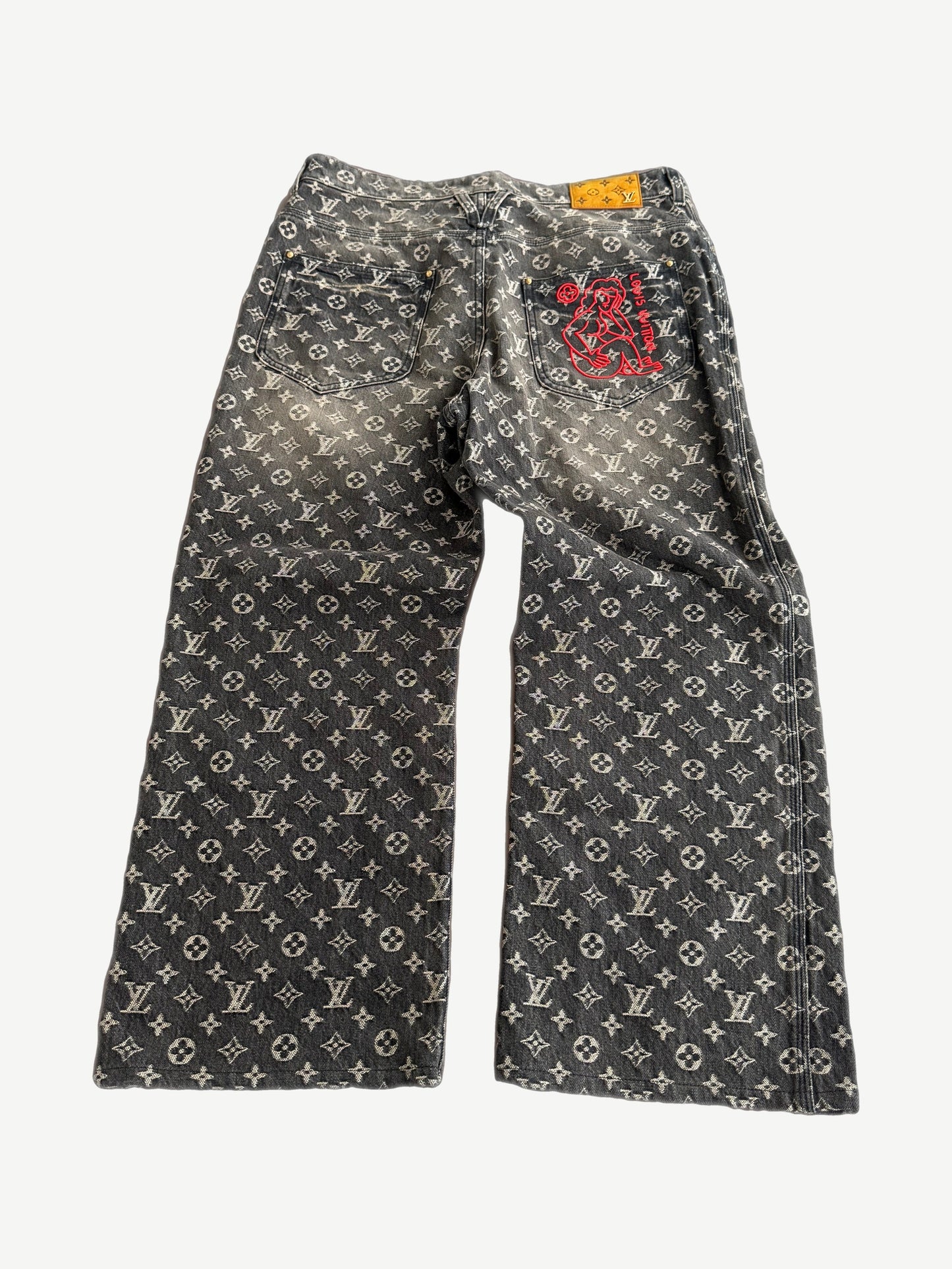 Louis Vuitton monogram denim pants back showing five-pocket styling and tonal black LV embossed jacquard