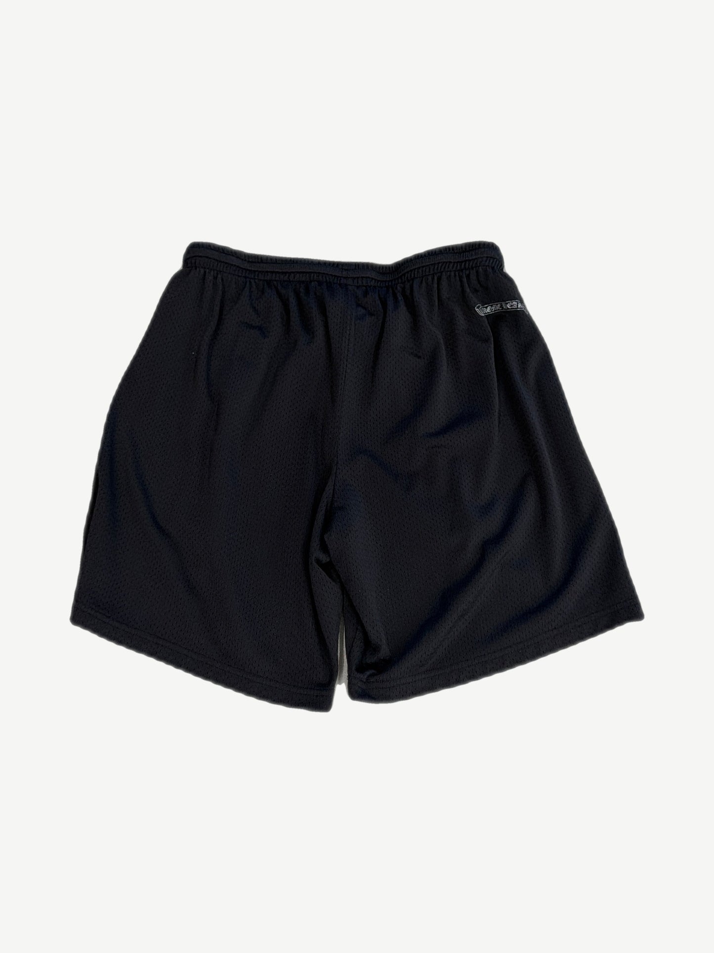 Chrome Hearts black mesh shorts back view with white Chrome Hearts gothic scroll patch on rear waistband.