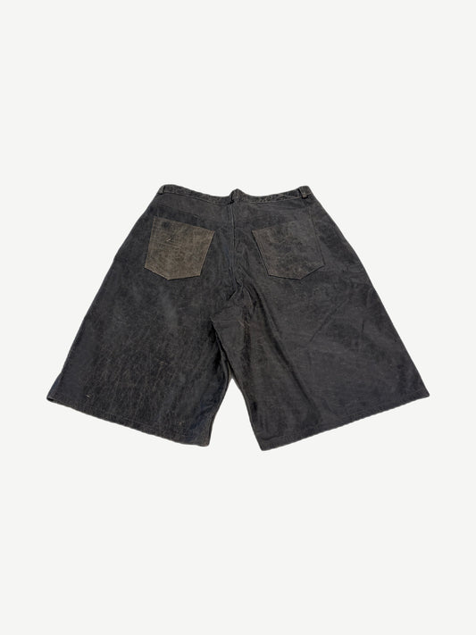 Raspberry Hills rust leather carpenter shorts back view with patch back pockets and contrast suede patch panels.