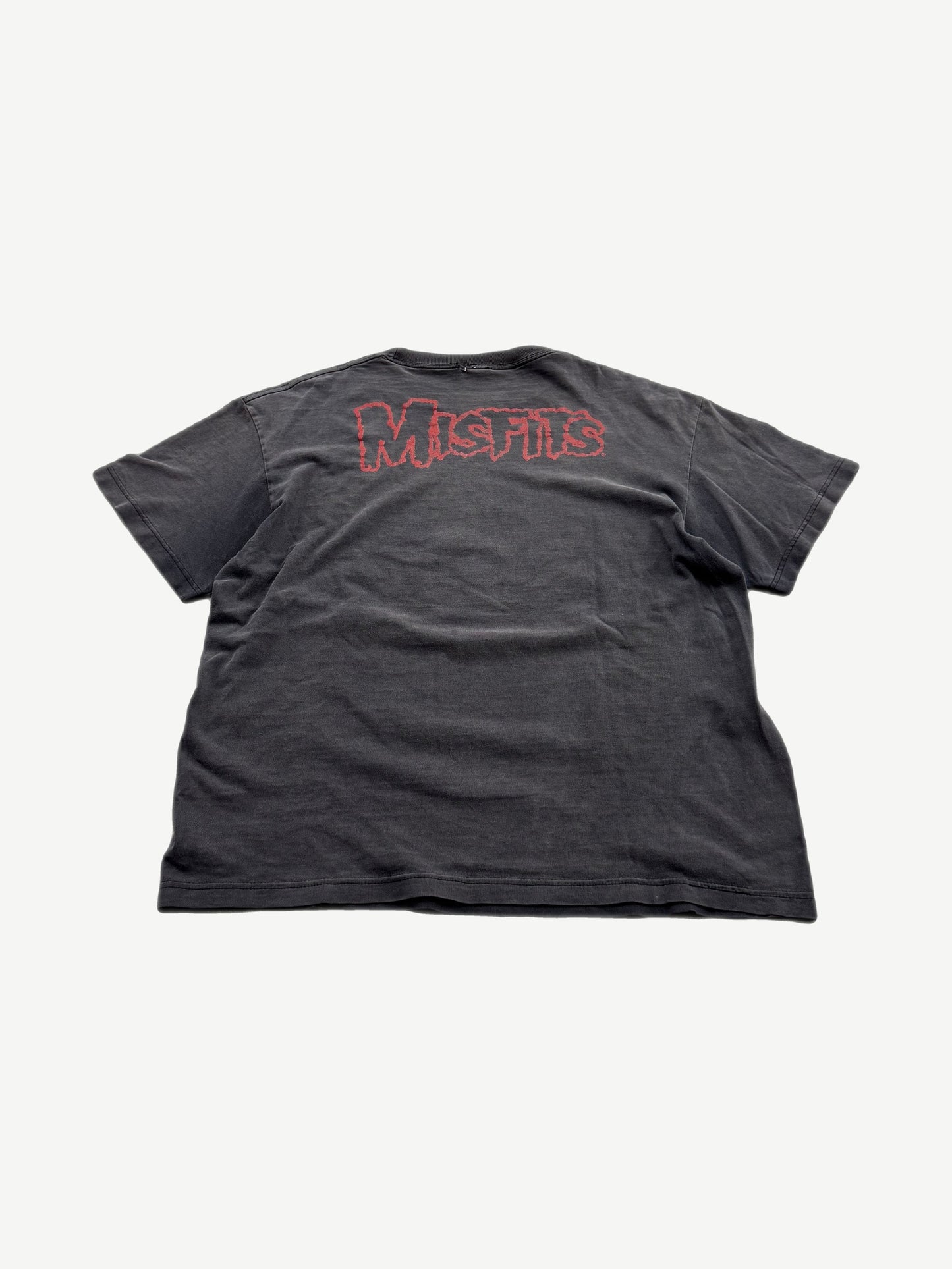 Back of vintage Misfits faded black tee with red outline Misfits logo print across upper back