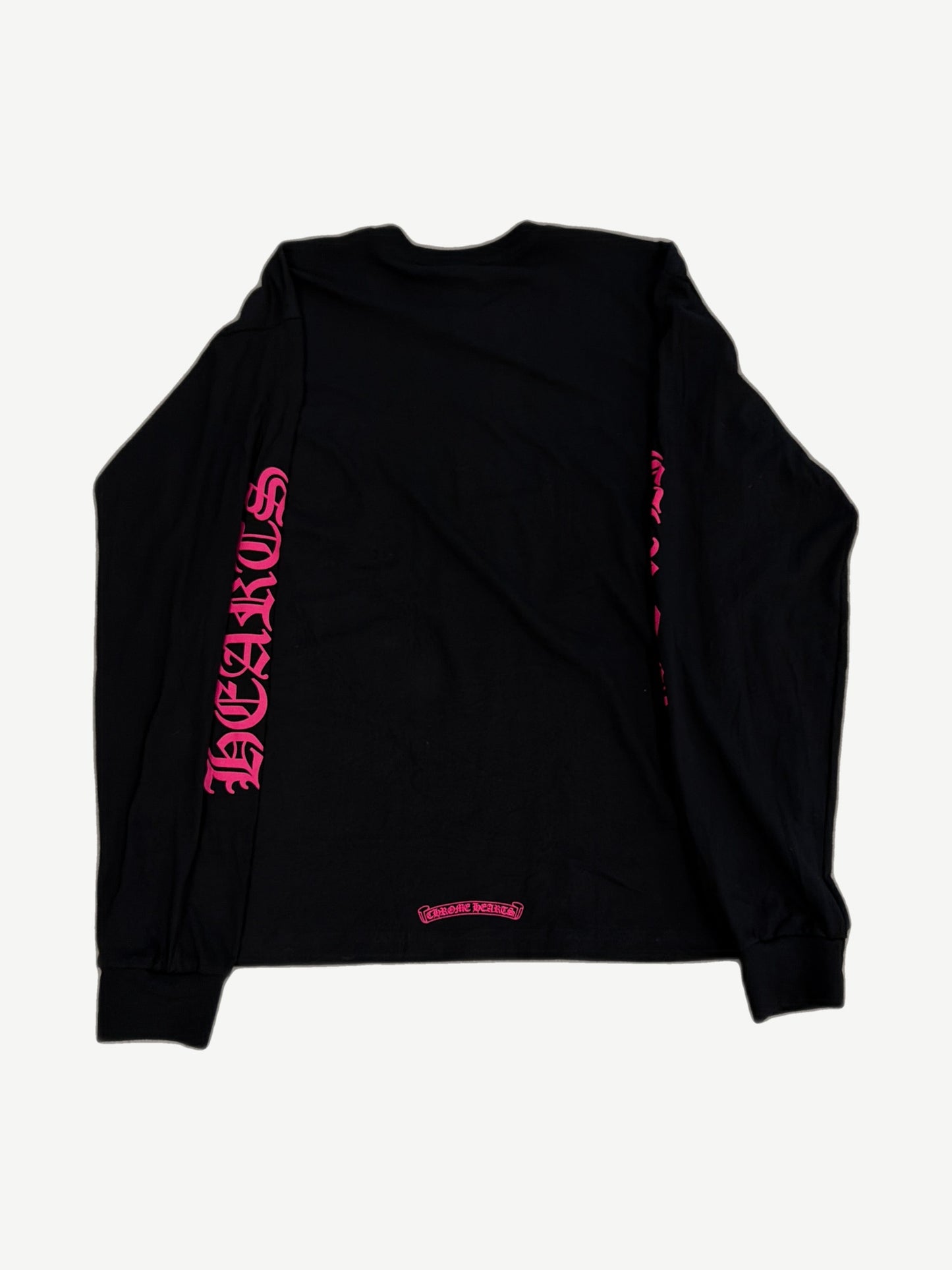 Chrome Hearts black longsleeve tee back with neon pink gothic sleeve lettering and small scroll logo at hem