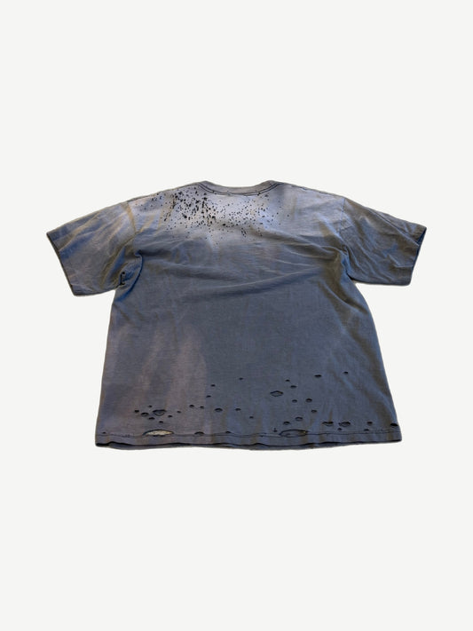 Back of vintage Die Hard tee in faded blue gray with sun fading, paint splatter and distressed hem holes