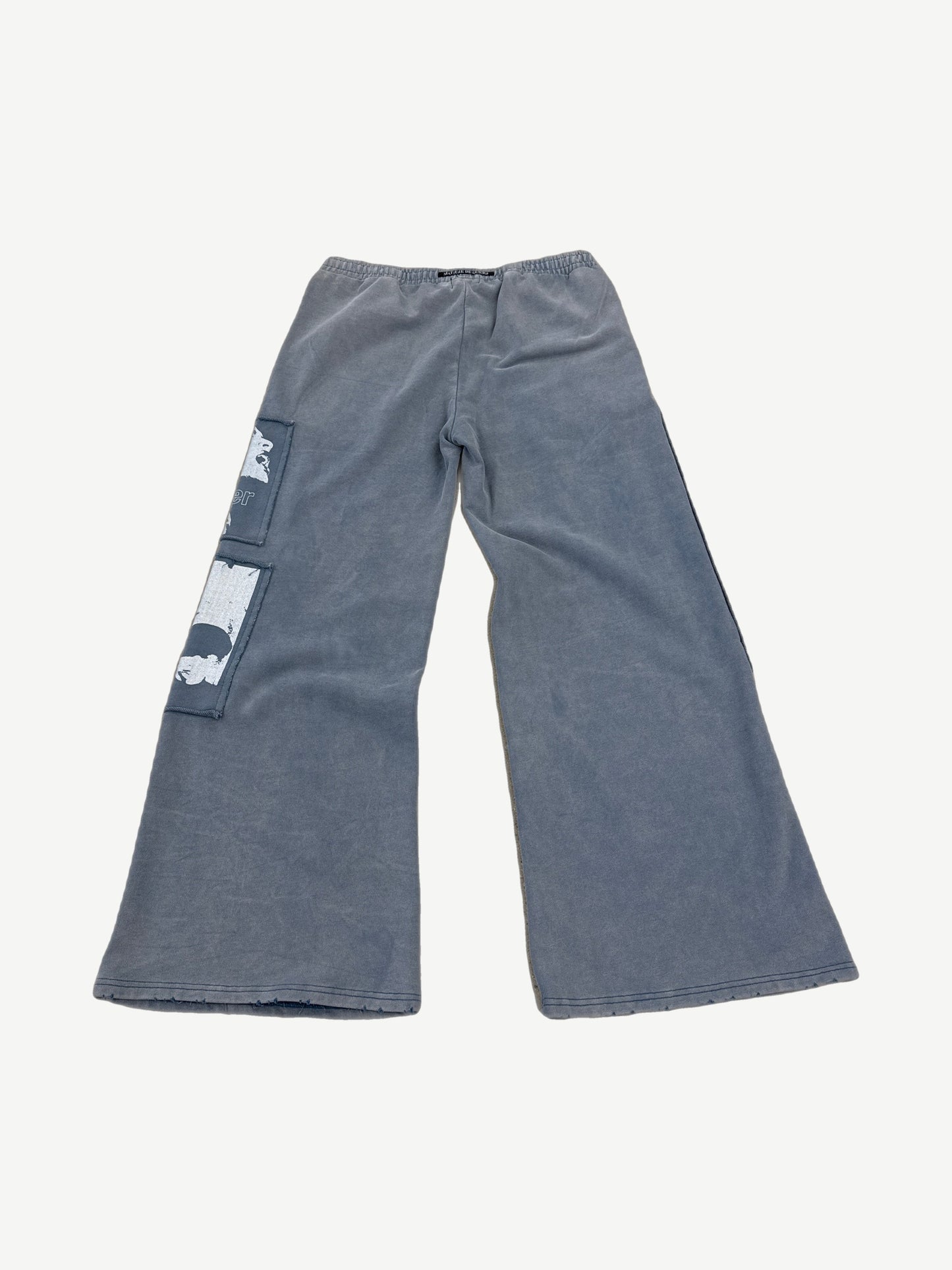 Matiere De Desires blue sweatpants back view showing relaxed tapered fit and clean fleece construction.