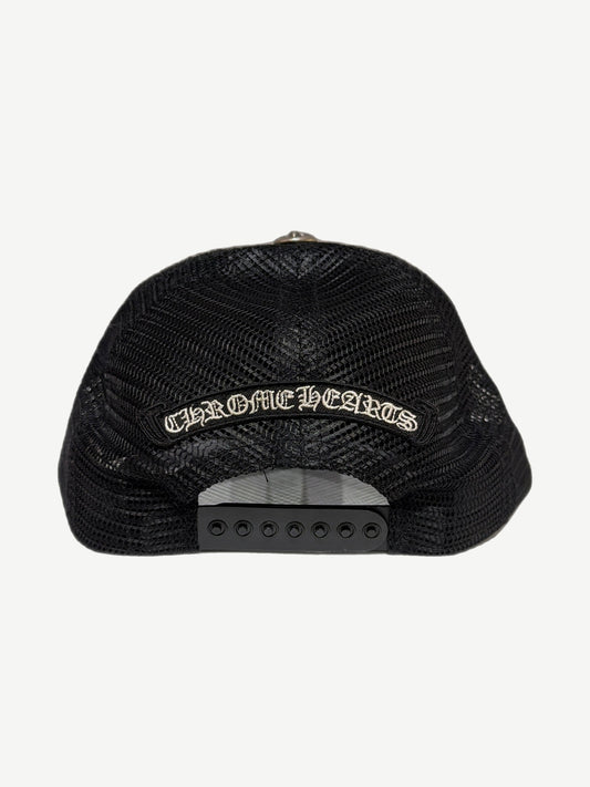 Chrome Hearts Cemetery trucker hat with multicolor cross patches scattered across black crown.