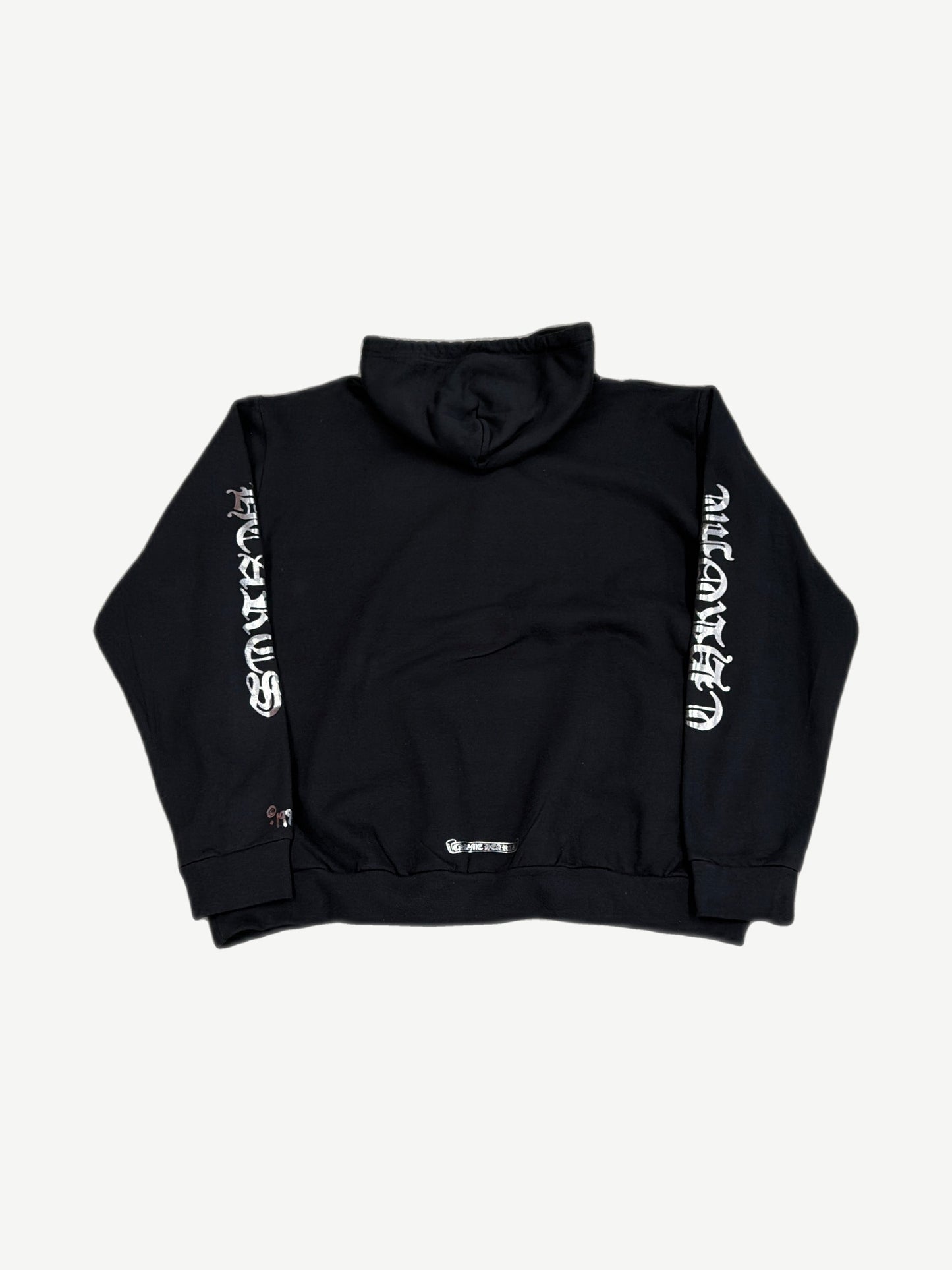 Back of Chrome Hearts 1988 black hoodie with silver metallic Chrome Hearts gothic script along sleeves