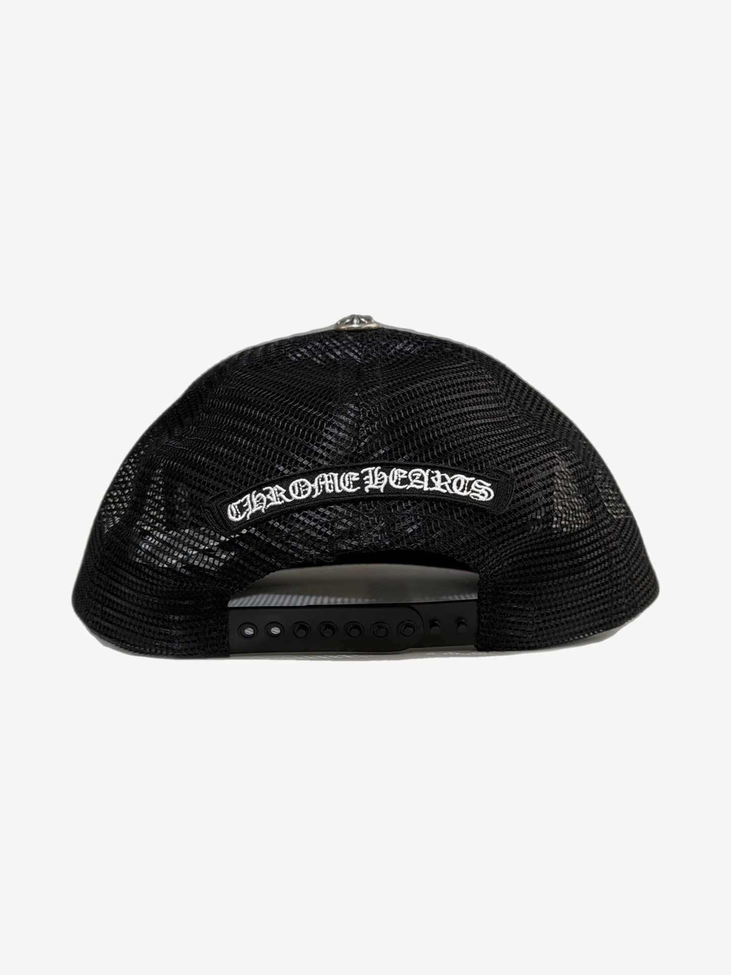 Chrome Hearts black trucker hat back showing white embroidered gothic logo banner and snapback closure