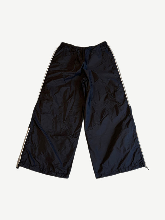 Happy Memories Don't Die HMDD black trackpants back view with white piping and zipped ankle gussets.