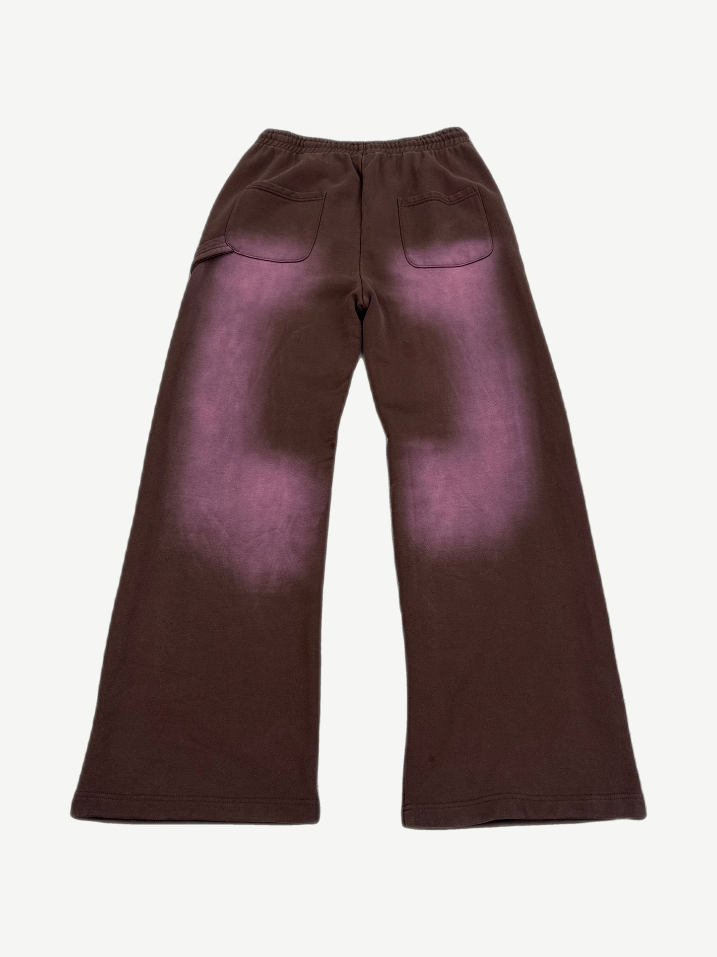 Back of HMDD brown sweatpants showing faded purple sun-bleached fade across seat and rear pockets.