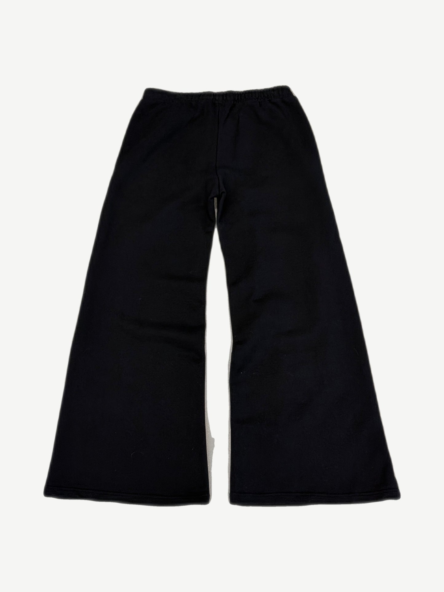 Bottega Desires black wide-leg sweatpants rear view with elastic waistband and flared cotton fleece silhouette