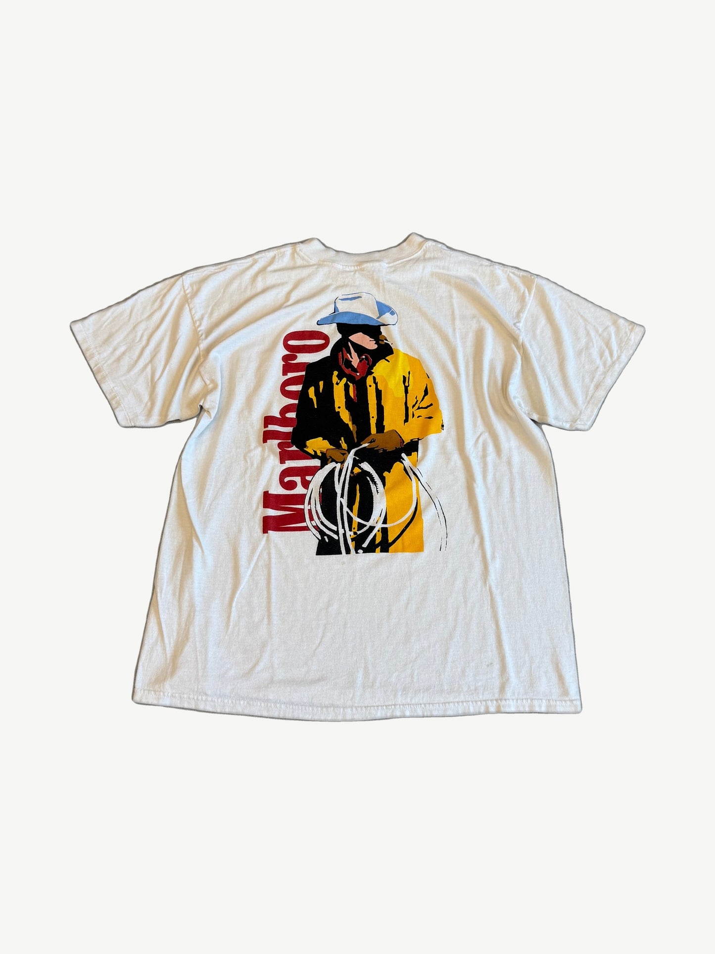 Vintage Marlboro cowboy tee back with cowboy roping graphic in yellow and red Marlboro script lettering
