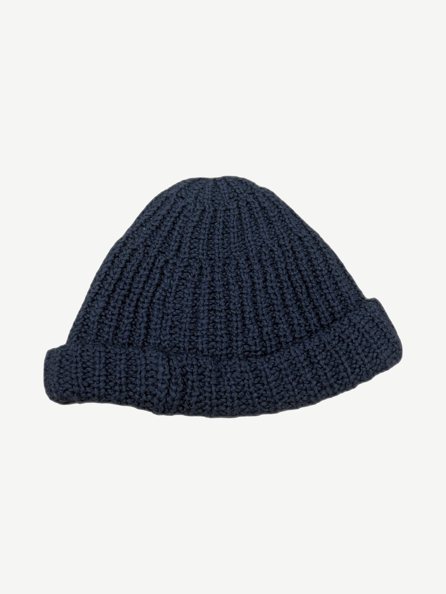 Back view of Paly Hollywood blue hand-knit beanie showing ribbed chunky cable texture and rolled cuff.