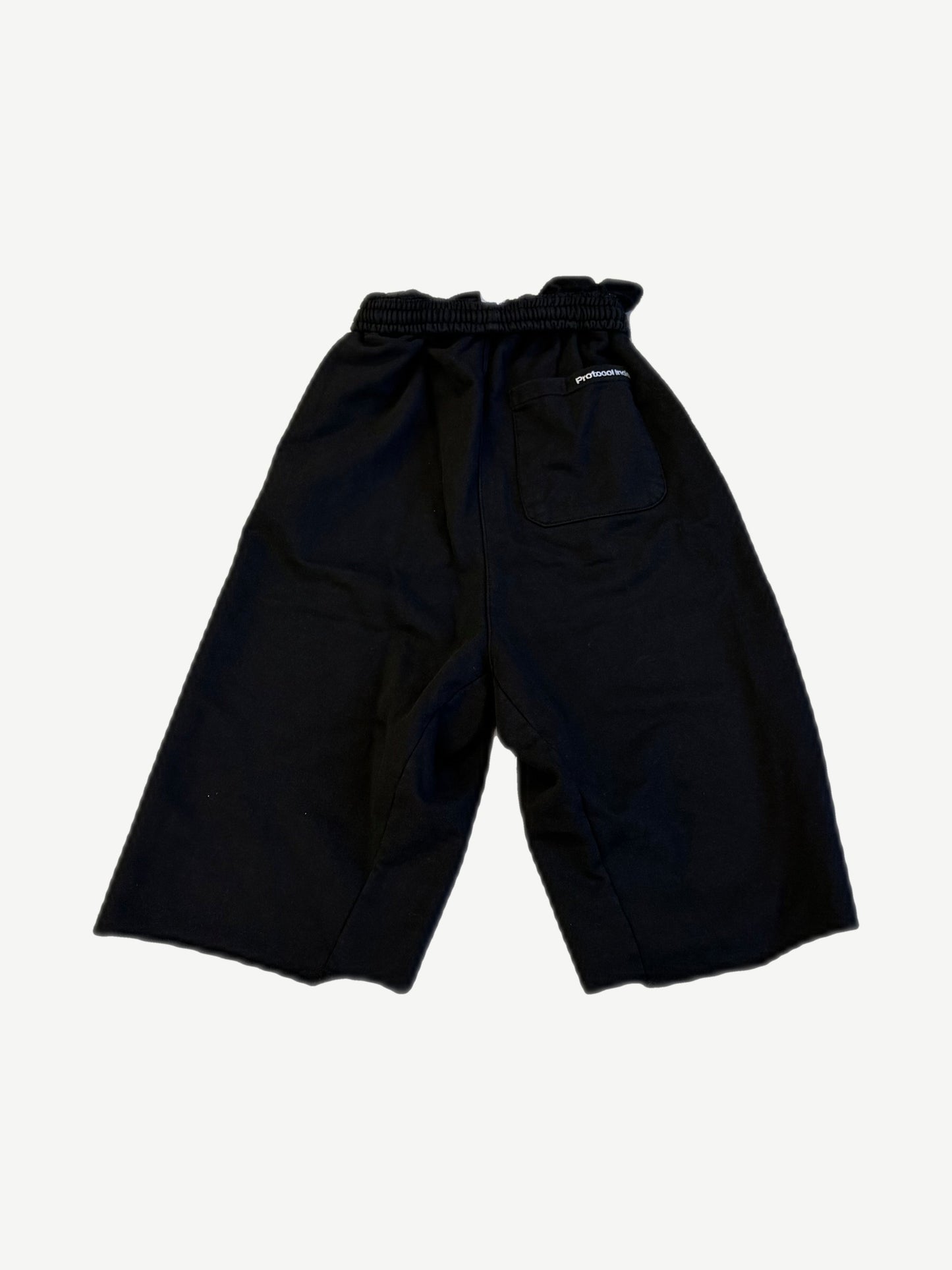 Protocol Index black folded waist shorts back with single rear patch pocket and small logo tag