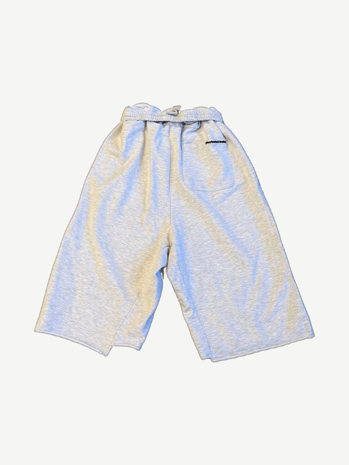 Protocol Index melange shorts back, heather grey fleece with single rear patch pocket and protocol index tag.