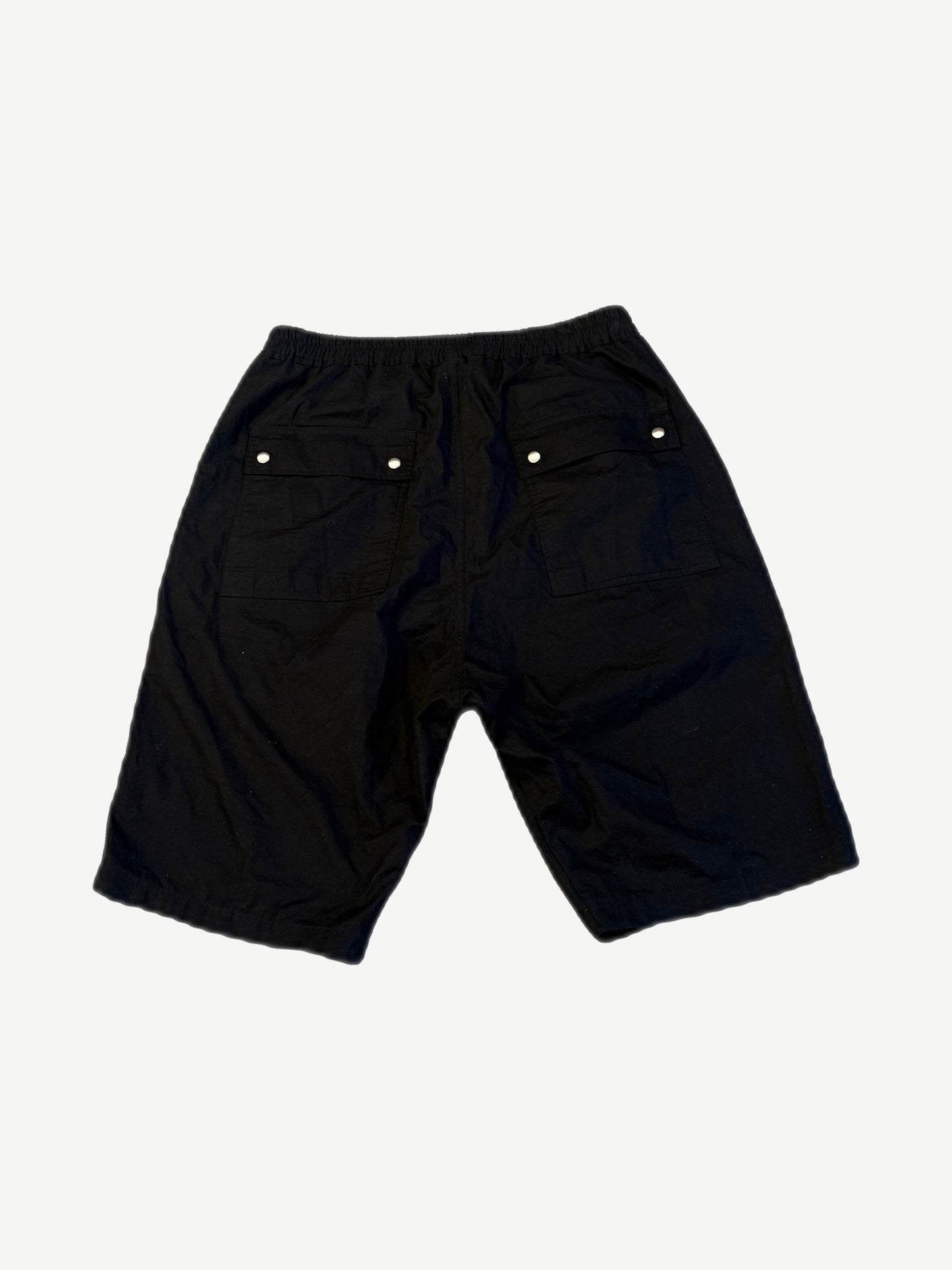 Rick Owens Bela Pods shorts back view in black cotton with twin flap pockets and snap closures.