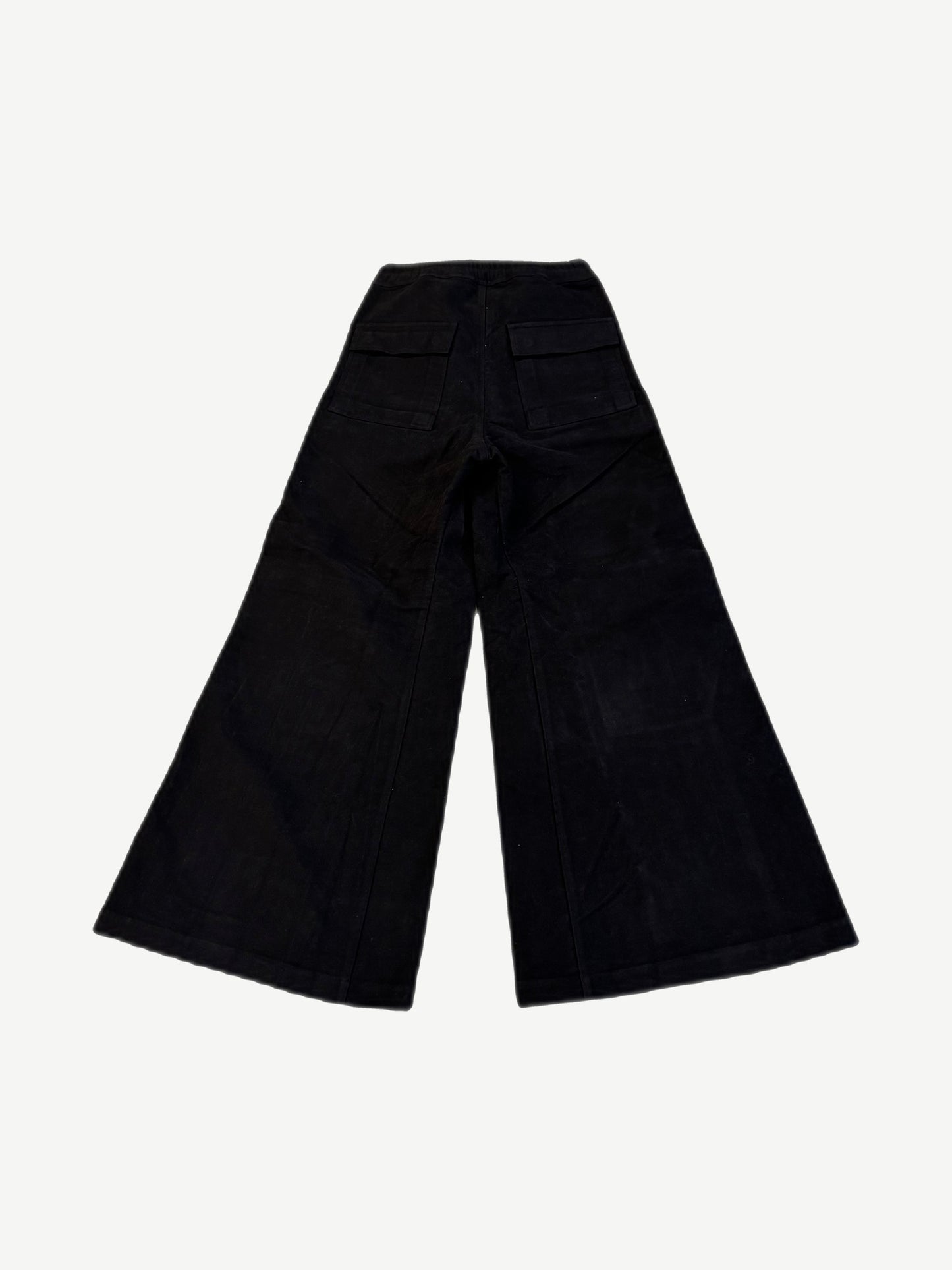 Back of Rick Owens Bela cargo pants in ecru canvas with utility back pockets and reinforced seam stitching.